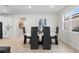 Elegant dining room with modern table and chairs, bright lighting, and stylish decor at 1002 River Falls Cir, Deland, FL 32720