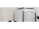 Convenient laundry room equipped with modern washer and dryer units at 1002 River Falls Cir, Deland, FL 32720