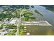 Scenic aerial view highlights property's proximity to the waterway and nearby marina with parking at 104 N Park Pl, Edgewater, FL 32132