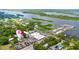 Panoramic aerial view showcasing the property's location near the water and a nearby marina with ample parking at 104 N Park Pl, Edgewater, FL 32132