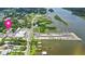 Scenic aerial view highlights property's proximity to the waterway and nearby marina with parking at 104 N Park Pl, Edgewater, FL 32132
