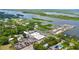 Panoramic aerial view showcasing the property's location near the water and a nearby marina with ample parking at 104 N Park Pl, Edgewater, FL 32132