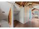 Unfinished attic space with hardwood flooring and partial closet at 104 N Park Pl, Edgewater, FL 32132