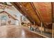 Unfinished attic space with hardwood flooring, dormer windows and exposed ceiling beams at 104 N Park Pl, Edgewater, FL 32132