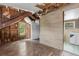 Unfinished attic room with hardwood floors and an attached bathroom at 104 N Park Pl, Edgewater, FL 32132