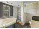 Bathroom undergoing renovation with modern tub and tiled shower at 104 N Park Pl, Edgewater, FL 32132