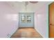 Bright bedroom with window, hardwood floors, and a ceiling fan at 104 N Park Pl, Edgewater, FL 32132