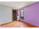 Bedroom with hardwood floors, window, and closet at 104 N Park Pl, Edgewater, FL 32132