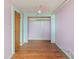 Bedroom with hardwood floors, fan, and closet at 104 N Park Pl, Edgewater, FL 32132