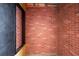 Room featuring exposed brick walls at 104 N Park Pl, Edgewater, FL 32132