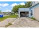 Open garage with concrete driveway, potential for a variety of uses at 104 N Park Pl, Edgewater, FL 32132