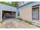 Attached garage with concrete driveway, showing potential for expansion and/or workspace at 104 N Park Pl, Edgewater, FL 32132