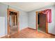 Living room featuring hardwood floors and open doorway at 104 N Park Pl, Edgewater, FL 32132