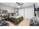 Bedroom featuring a bed, tv, ceiling fan and closet at 10800 Crescent Ridge Loop, Clermont, FL 34711