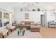 Inviting living room with a sectional sofa, wood flooring, and contemporary decor at 10800 Crescent Ridge Loop, Clermont, FL 34711