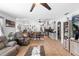 Open-concept living space with kitchen bar and ample natural light at 10800 Crescent Ridge Loop, Clermont, FL 34711