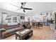 Open-concept living space with kitchen bar and ample natural light at 10800 Crescent Ridge Loop, Clermont, FL 34711