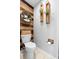 Stylish half bathroom featuring unique decor and a modern toilet at 10800 Crescent Ridge Loop, Clermont, FL 34711