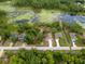 An aerial view of homes near a lush, green-filled body of water at 1092 Gage Ave, Deltona, FL 32738