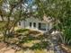 A bright backyard with mature trees offers plenty of shade and privacy at 1092 Gage Ave, Deltona, FL 32738