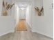Inviting hallway with tiled floors, decorative insets and a neutral palette, enhancing the home's interior appeal at 1092 Gage Ave, Deltona, FL 32738