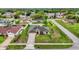 An aerial view shows the house with a well-maintained yard in a residential neighborhood at 1101 Anderson St, Deltona, FL 32725