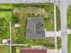 An aerial view features a well-maintained yard and a utility shed at 1101 Anderson St, Deltona, FL 32725