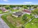 A serene neighborhood aerial view highlights mature trees and a home with a well-kept lawn at 1101 Anderson St, Deltona, FL 32725