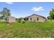 Backyard with a shed and manicured landscaping at 1101 Anderson St, Deltona, FL 32725