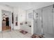 This bathroom features a glass-door shower and a soaking tub next to a glass block window at 1101 Anderson St, Deltona, FL 32725