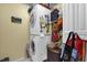 Functional laundry area with stacked washer and dryer, plus extra storage at 1101 Anderson St, Deltona, FL 32725
