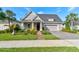 Charming single-Gathering home featuring a well-manicured lawn and attached two-car garage at 112 Chelsea Place Ave, Ormond Beach, FL 32174
