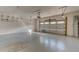 Bright garage featuring white walls, epoxy floors, and an insulated garage door at 112 Chelsea Place Ave, Ormond Beach, FL 32174
