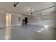 Spacious garage with plenty of room for parking and storage, including overhead storage racks at 112 Chelsea Place Ave, Ormond Beach, FL 32174
