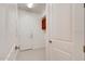 Hallway with white walls, white doors, and a built-in cabinet at 112 Chelsea Place Ave, Ormond Beach, FL 32174