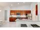 Modern kitchen featuring granite countertops, stainless steel appliances, and ample cabinet space at 112 Chelsea Place Ave, Ormond Beach, FL 32174