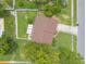 Aerial top-down view of a well-maintained home with a fenced yard and patio at 1166 Tracy Dr, Port Orange, FL 32129