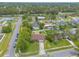 Aerial view of a well-kept neighborhood with homes, trees, and surrounding streets at 1166 Tracy Dr, Port Orange, FL 32129