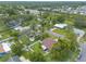 Aerial view of a residential neighborhood showcasing mature trees and proximity to power lines at 1166 Tracy Dr, Port Orange, FL 32129