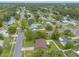 Expansive aerial view of a neighborhood with mature trees and well-maintained homes at 1166 Tracy Dr, Port Orange, FL 32129
