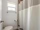 Updated bathroom featuring tiled shower and a window providing natural light at 1166 Tracy Dr, Port Orange, FL 32129
