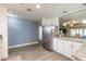 Large kitchen features stainless appliances, granite countertops and tiled flooring at 1166 Tracy Dr, Port Orange, FL 32129