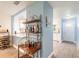 View of the kitchen with granite countertops, bar, and open access to the dining area at 1166 Tracy Dr, Port Orange, FL 32129