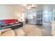Open concept living room features views into the kitchen and access to front entry at 1166 Tracy Dr, Port Orange, FL 32129