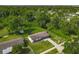 Overhead shot of a charming home nestled amidst a lush, green wooded area, offering privacy at 1203 W 20Th St, Sanford, FL 32771