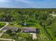 Aerial view of a lovely home with a spacious backyard and a peaceful wooded surrounding at 1203 W 20Th St, Sanford, FL 32771