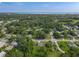 Expansive aerial view showcasing a peaceful residential area with lush greenery and charming homes at 1203 W 20Th St, Sanford, FL 32771