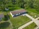 An aerial perspective showcases a cozy home with a large, well-kept yard in a serene location at 1203 W 20Th St, Sanford, FL 32771