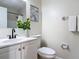 Bright bathroom featuring a white vanity, black faucet, and decorative wall art at 1203 W 20Th St, Sanford, FL 32771