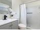 Bathroom featuring a shower with white tile, a new vanity, and modern fixtures at 1203 W 20Th St, Sanford, FL 32771